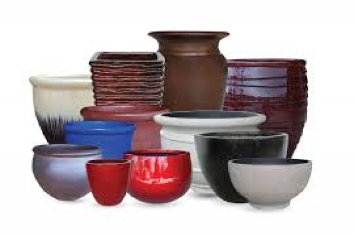coloured fiber pots with different size on white background 